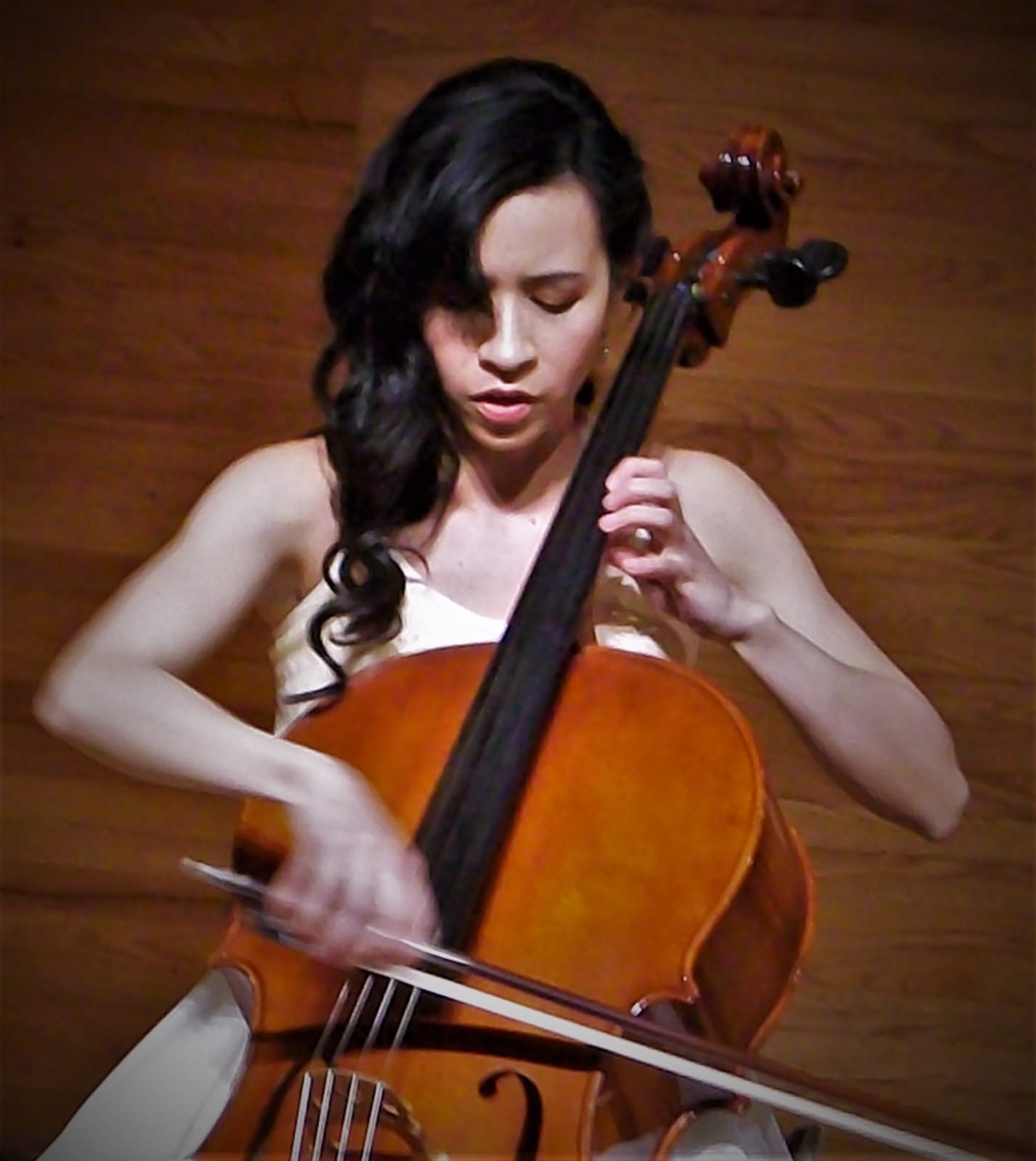House concert with cello and piano in a living room